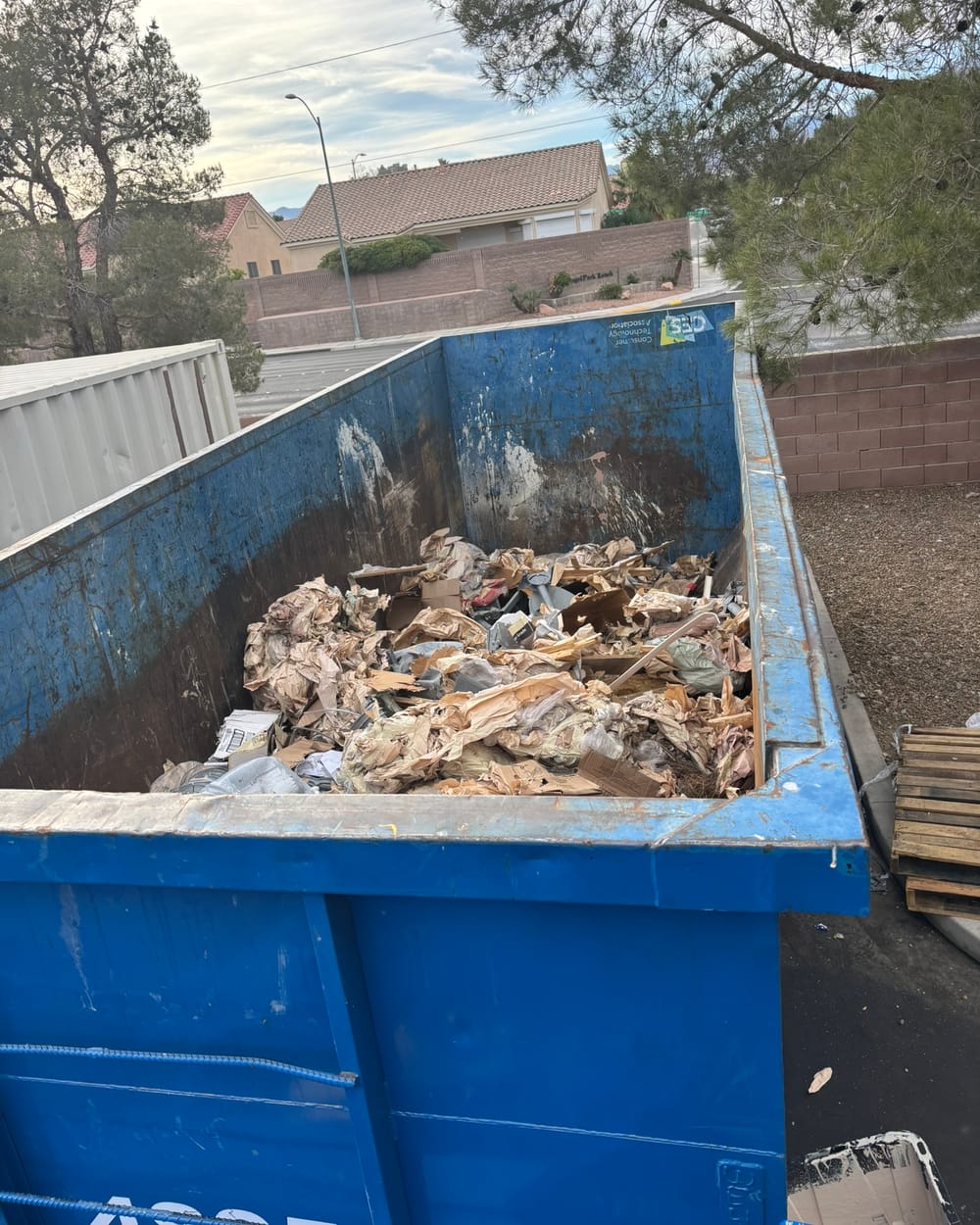 The same container after compaction, contents packed flat.